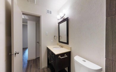 Bathroom featuring hardwood / wood-style floors, v