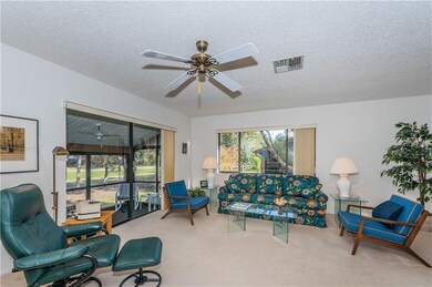 Living Room Into Enclosed Patio with Golf Course V
