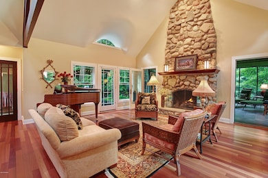 Living room with stone fireplace