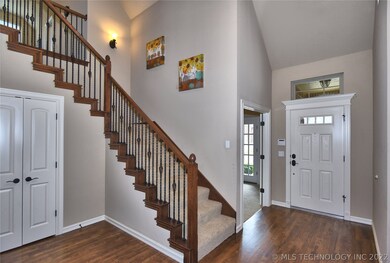 The two story front foyer showcases the beautiful,