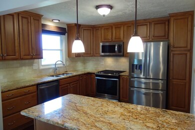 Breakfast bar with more cabinets! Open to dining a