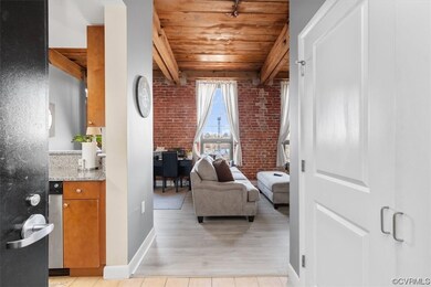 Living room with wood ceiling, light wood-type flo