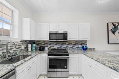 Kitchen featuring stainless steel appliances, orna