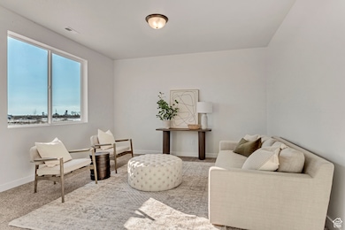 PHOTOS OF A SIMILAR HOME. COLORS, OPTIONS, AND FEATURES WILL VARY. Great room featuring carpet and baseboards