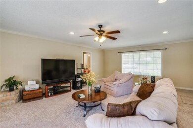 Another view of large living area with large windo