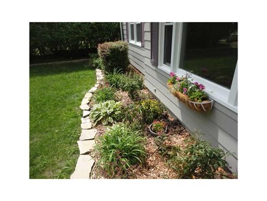 Front Exterior. Gorgeous landscaping lined with li