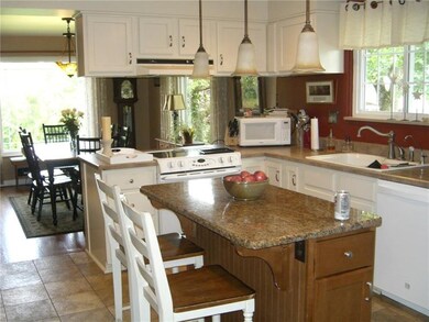 Light and bright eat in kitchen with newer cabinet