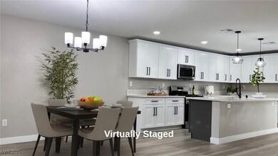 Kitchen featuring pendant lighting, white cabinets, light wood-type flooring, stainless steel appliances, and recessed lighting