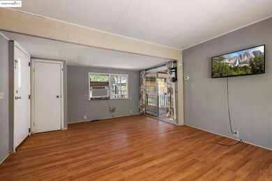 Empty room with wooden walls and wood finished floors