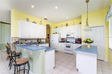 BREAKFAST BAR AT COUNTER, LARGE CLOSET PANTRY.