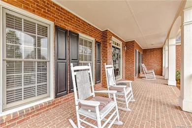 DEEP covered front porch.  Plenty of room for seat