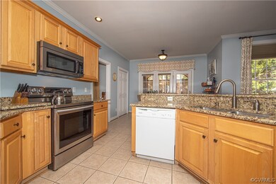 Kitchen with ceramic tile floor, granite counter t