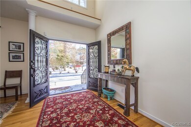 Beautiful front doors out to nicely landscaped fro