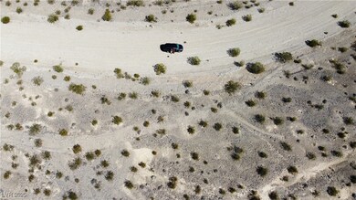Bird's eye view from dirt road and vacant lot. Buyers to verify property line.