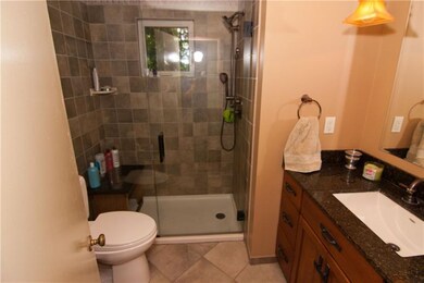 The hall bath has been completely updated with gor