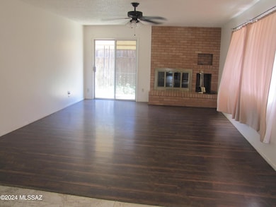 Living room with FP and door to small pa