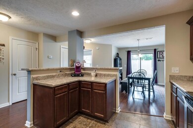 PLENTY OF SPACE FOR BAR STOOLS AND ISLAND DINING