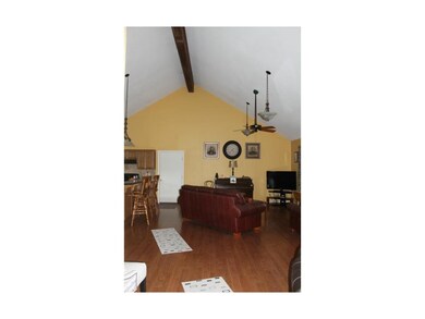 Living room w/vaulted ceiling.