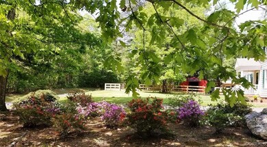 Mature landscaping with beautiful azaleas and asso