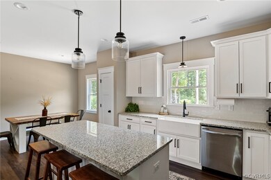 Kitchen featuring a kitchen island, dark hardwood