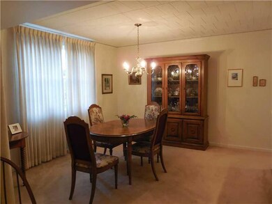 Dining Room. The Diningroom is carpeted and looks 