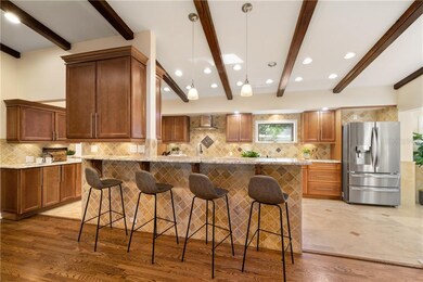 Plenty of seating at the bar, and lots of storage with extra cabinetry