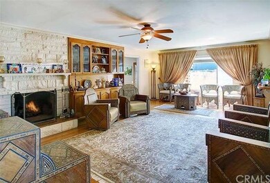 Large living room with fireplace and built-ins. 