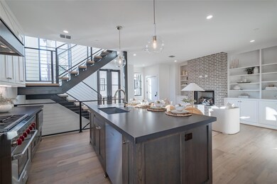 Kitchen featuring dark brown cabinetry, sink, an i