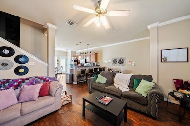 Spacious open-concept living area seamlessly connected to the kitchen and dining space. (Unit 203)