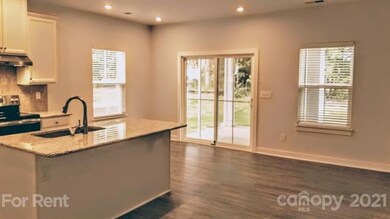 Kitchen & dining area can expand out to the screened porch.  Sliders open to porch & back yard.