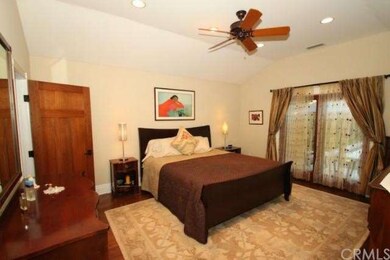 Large master suite has tall ceilings, huge walk-in