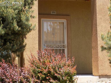 Property entrance featuring stucco siding