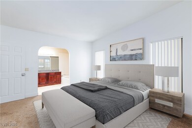 Bedroom with connected bathroom, arched walkways,