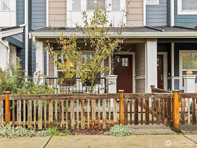 East facing with attached garage in back.