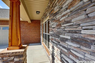 Enjoy relaxing on this spacious covered front porch - pure serenity!
