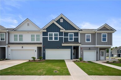 Craftsman inspired home with board and batten siding, a front lawn, concrete driveway, and an attached garage