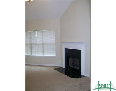 The den has a fireplace and door to covered patio area. Perfect for entertaining!