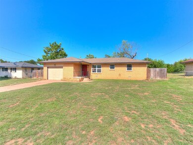 Ranch-style house featuring a garage and a front l