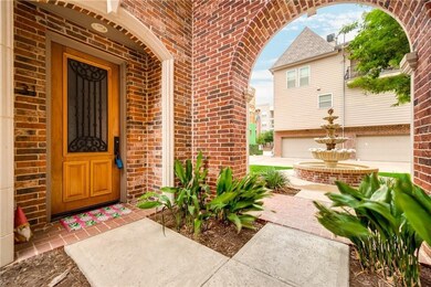 Doorway to property featuring brick siding