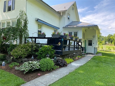 back view with deck in the summer time