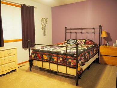 Larger of two upper level bedrooms