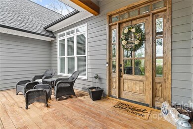 This wide open front deck/porch lets you look out over the water of Lake Norman too! This home is literally surrounded by water on three sides