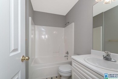 The main level hall bathroom shared by two bedroom