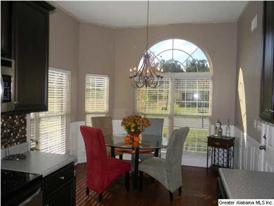 Natural light from gorgeous windows fills the kitc
