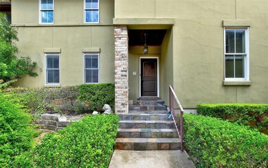 Entrance to property featuring stucco siding