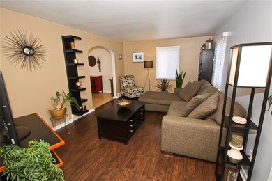 The living room is spacious and features updated n