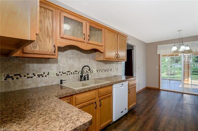 Kitchen with tile backsplash nice counter space and cabinets.
