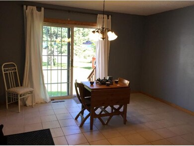 Pretty french patio doors lead to fenced in backya