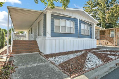 View of front facade featuring stairs and covered porch