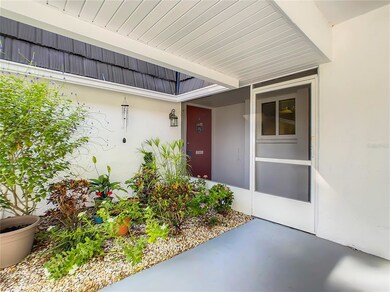 covered parking with screen room entry
